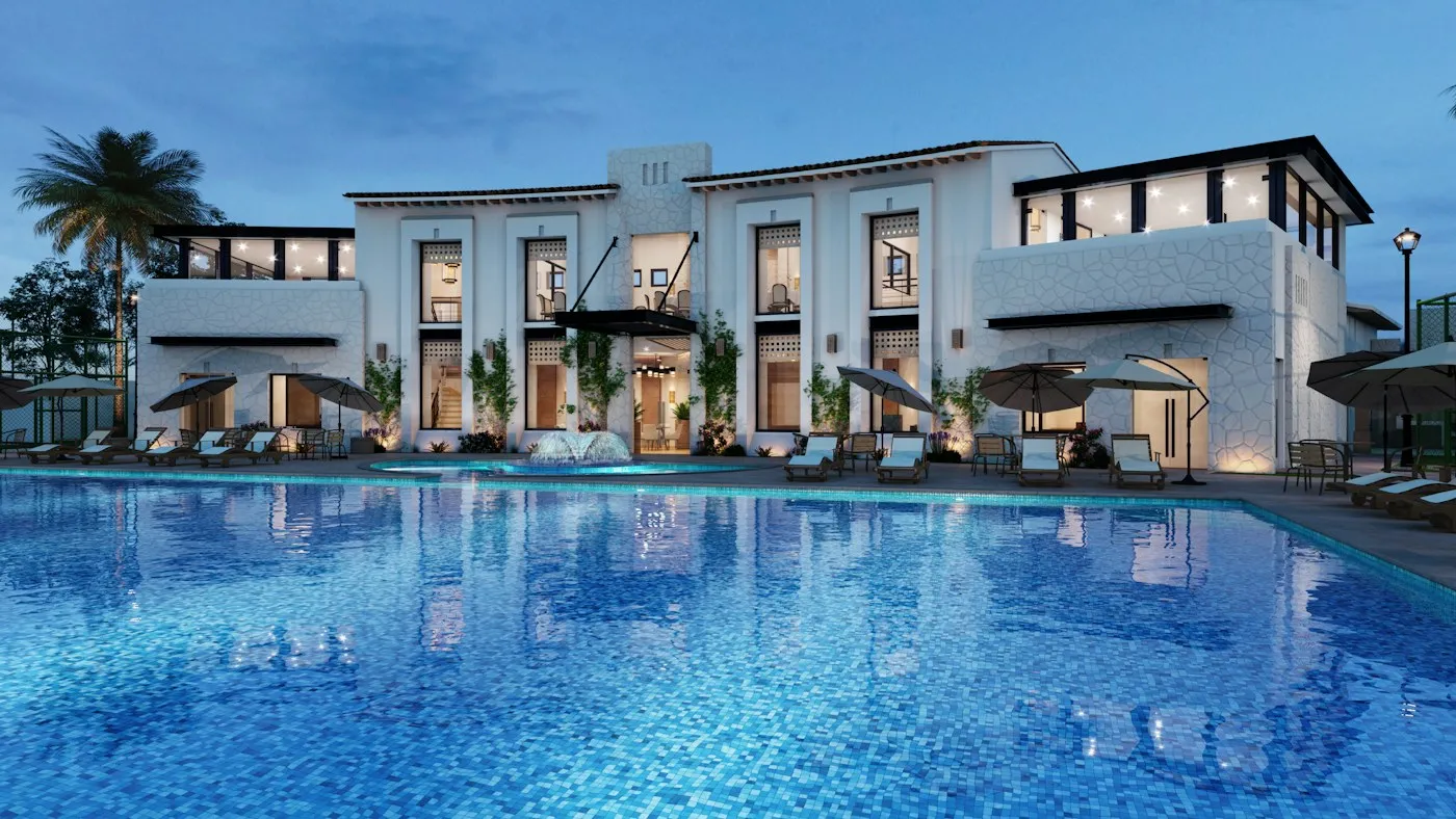 A characterful hotel property with a pool at dusk